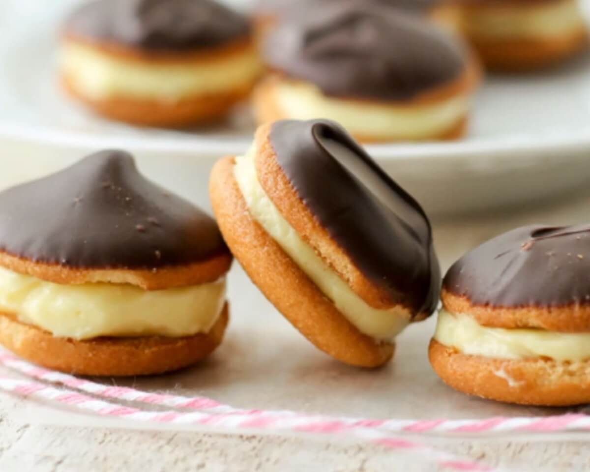 Eclair Cookies, Cream-Filled Pastry Cookies, French-Inspired Dessert, Homemade Cookie Recipe, Puff Pastry Delights, Chocolate Glaze Cookies, Eclair-Inspired Treats, Irresistible Sweetness, Custard-Filled Cookies, Mini Eclair Pastries, Decadent Dessert, Cookie Versions of Eclairs, Choux Pastry Cookies, Elegant Dessert Bites, Creamy Filling, Delicate Puff Pastry, Chocolate Drizzle Cookies, Heavenly Cookie Creations, French Bakery Favorites, Fancy Pastry Cookies, Indulgent Sweet Treats, Bite-Sized Eclairs, Flaky and Delicious, Chilled Pastry Desserts, Eclair Cookie Pops